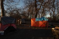 Homeless Encampment In Park (Image via Getty)